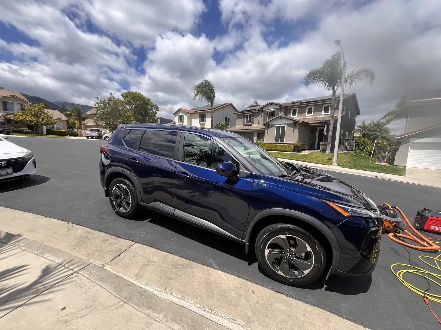 Dark blue crossover viewed from the side
