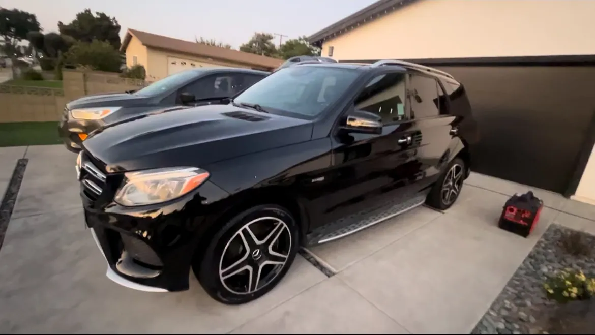 Black Mercedes-Benz SUV viewed from the front corner