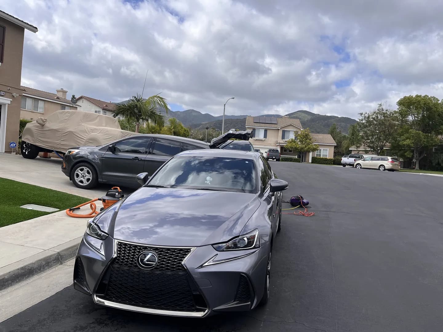 Gray Lexus sedan viewed from the front
